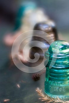 Vintage green glass insulators in a row