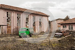 Vintage Green truck in abandoned factory backyard