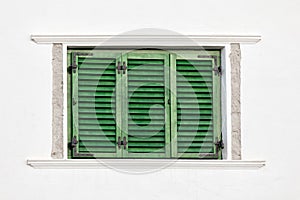 Vintage green window on white wall