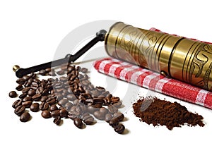 Vintage grinder, coffee beans and ground coffee