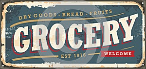 Vintage grocery store sign on old metal texture