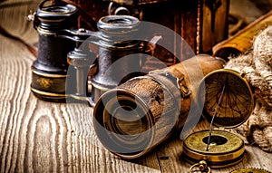 Vintage grunge still life. Antique items on wooden table