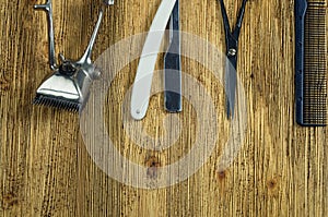 Vintage hairdressing tools on a rough wooden