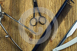 Vintage hairdressing tools on a rough wooden