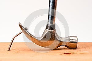 Vintage hammer nail puller pull bent big nail out of the board