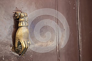 Vintage hand doorknocker