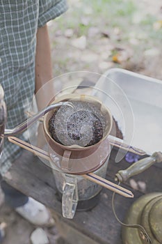 vintage Hand drip coffee, Barista pouring water on coffee groun