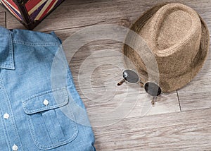 Vintage hat , sunglasses and chambray shirt photo