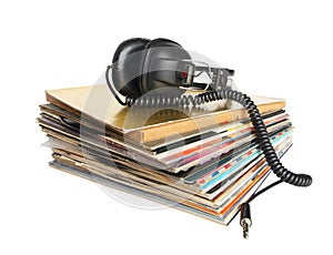 Vintage headphones on the stack of vinyl records