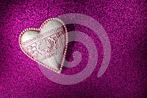 Vintage heart on purple glitter texture, celebrate valentines day or love, background