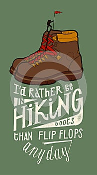 Vintage hiking boots with a tine hiking person on the top of them and a motivational lettering quote photo