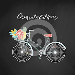 Vintage hipster bicycle with gift box, pinapple and flowers inside basket. on chalkboard background