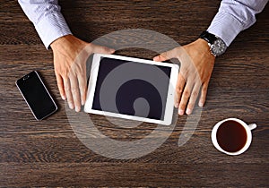 Vintage hipster wooden desktop top view, male hands using laptop