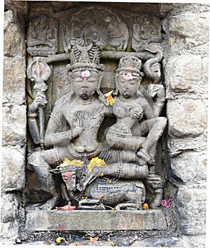 Vintage historic stone art of Indian Gods in an ancient Hindu Indian temple