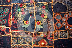 Vintage homemade patchwork background. Colorful ethnic handmade details and patterns on texture of old blanket.