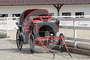 Vintage horse drawn carriage in stable parking