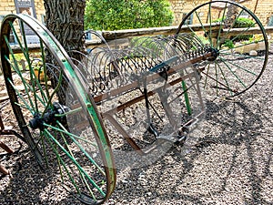 Vintage horse-drawn mechanical hay rake