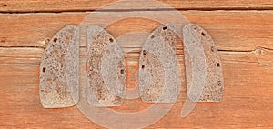 vintage horseshoes on a background of orange boards