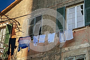 Vintage house facade with clothes on rope