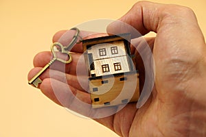 Vintage House key with home keyring on the hand - New home concept - Give gift , congratulation