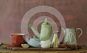 Vintage household objects and kitchen utensils,coffee pot,beaker,watering can and mug with free copy space