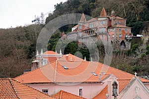 Vintage houses and mansions built into a hillslope lush with greenery, Sintra, Portugal