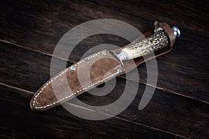 Vintage hunting knife with leather holster