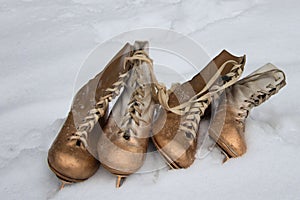 Vintage ice skates for figure skating lying on the snow