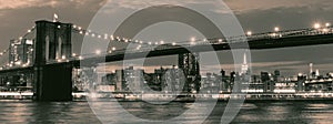 Vintage image of the Brooklyn Bridge illuminated at night