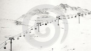 Vintage image of people in chairlift photo