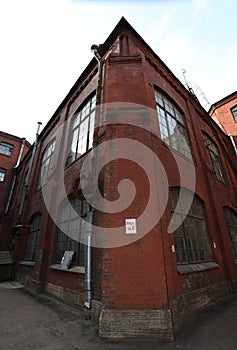 Vintage industrial red brick building in the industrial area of the old European city.