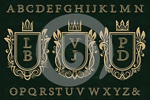 Vintage initial logos kit. Coat of arms frames, starry patterned letters, isolated alphabet