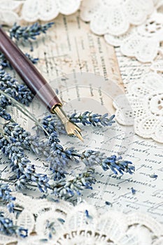 Vintage ink pen, dried lavender flowers and old love letters