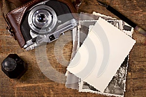 Vintage ink and pen, old photos and camera