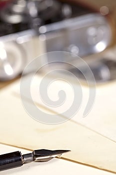 Vintage ink pen, old photos and camera