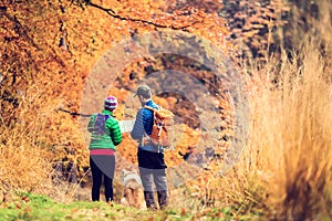 Vintage instagram couple hiking in autumn forest