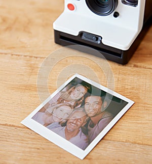 Vintage Instant Film Camera With Print Of Senior Parents And Adult Offspring Posing For Selfie