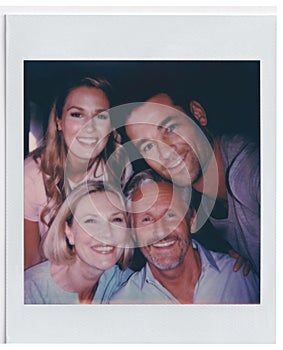 Vintage Instant Film Print Of Senior Parents And Adult Offspring Posing For Selfie photo