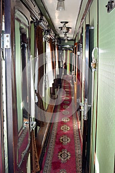 Vintage interior of a luxury  carriage in a retro train. The beginning of the 20th century