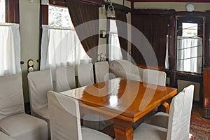 Vintage interior of a luxury  carriage in a retro train. The beginning of the 20th century