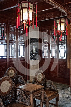 Vintage interior of royal pavilion in Yu Yuan Garden of Shanghai old city in China. Antique ornate furniture and lanterns