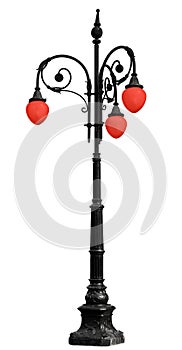 Vintage iron lamppost with red light isolated on white