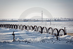 Vintage iron wheel tractor in the snow