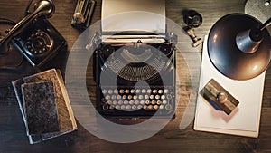 Vintage journalist desktop with typewriter and telephone