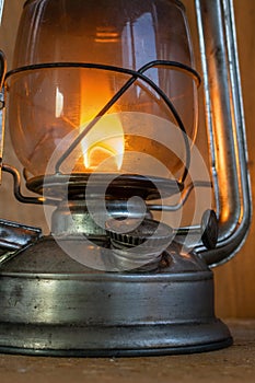 Vintage kerosene lamp with fire inside and glass bulb