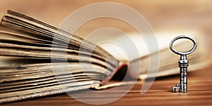 Vintage key with book, life coaching, solution banner