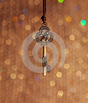 Vintage key on a shiny background