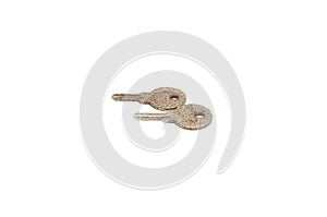 Vintage key on white background close-up. Texture, background, old, macro, wallpaper, metal, brass