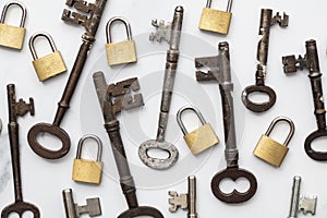 Vintage keys and padlocks overhead lay flat composition. Security concept