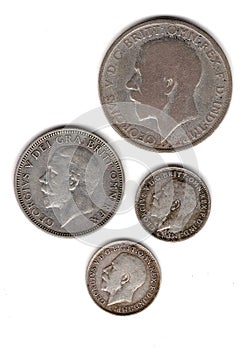 Vintage King George V silver coins from the United Kingdom.